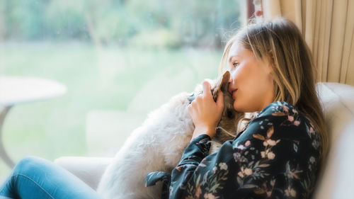 Young woman sitting on horse