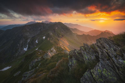 Scenic view of mountains against sky during sunset