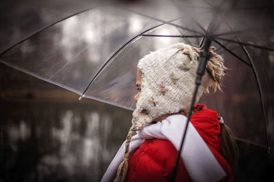 Rear view of woman with red umbrella