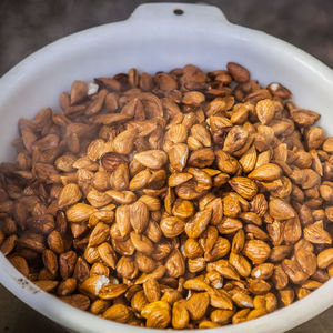 High angle view of roasted coffee beans in container