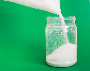 Close-up of water bubbles against green background