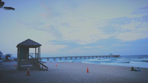 Scenic view of beach at sunset