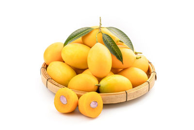 Close-up of oranges against white background