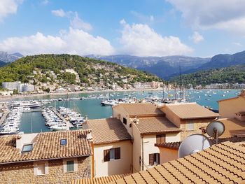 High angle view of townscape by sea