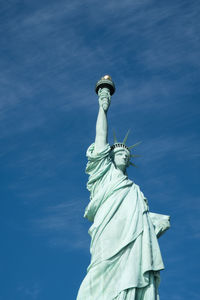 Statue of liberty against blue sky