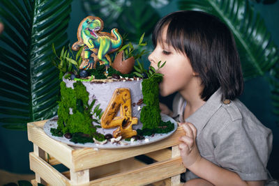 Baby boy eats bites cake on his birthday