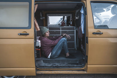 Surfing girl lifestyle in her van