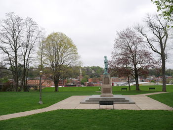 Park in city against sky