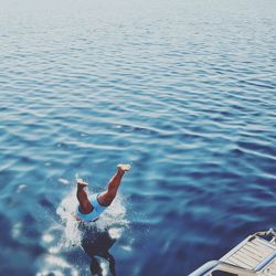 Man jumping into sea