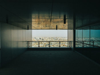 Scenic view of cityscape through balcony