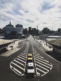 High angle view of vehicles on road against sky