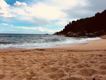 Scenic view of beach against sky