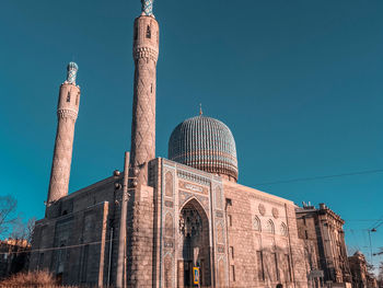 Low angle view of historical building against blue sky