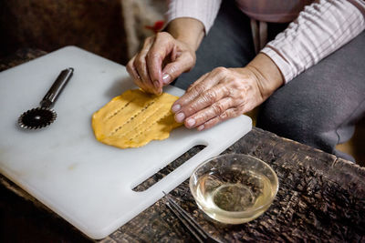 The preparation of a traditional food, sweet fritter called filhós from portugal. christmas time. 