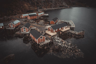 High angle view of houses by sea and buildings