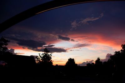 Silhouette trees against sky during sunset