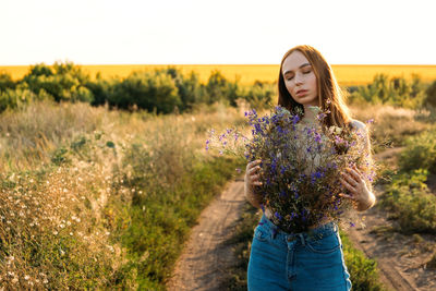 Healing power of nature, benefits of ecotherapy, nature impact wellbeing. happy young girl holding