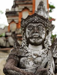 Close-up of statue against temple