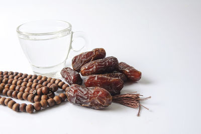 Close-up of breakfast on table against white background