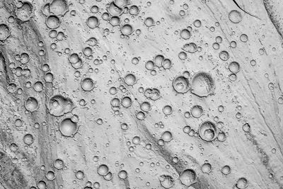 Small craters in mud volcanoes's clay river