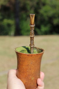 Close-up of hand holding drink