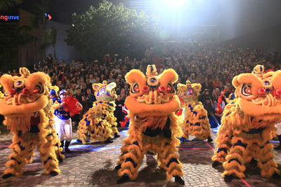 Group of people in toys at night