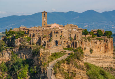 Castle on mountain against sky