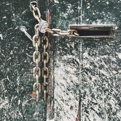 Close-up of padlocks on metal chain