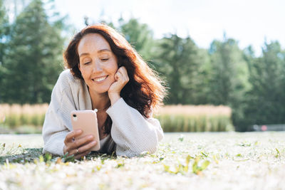 Young woman using mobile phone