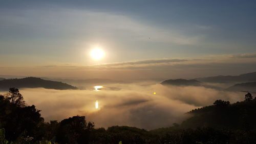 Scenic view of silhouette mountains against sky during sunset