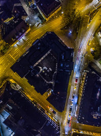 High angle view of illuminated street amidst buildings in city