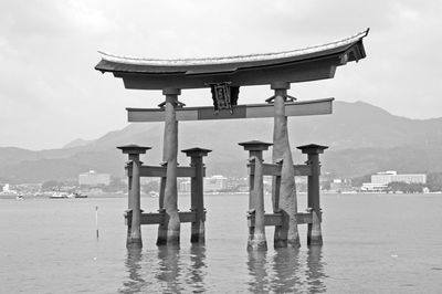 Gazebo in sea against building