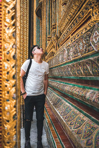 Full length of young man standing in temple