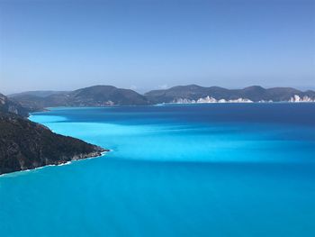 Scenic view of sea against clear blue sky