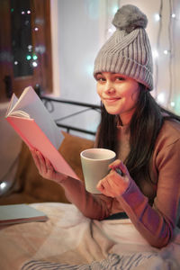 Young woman drinking coffee cup