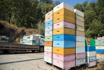 View of multi colored stack against trees