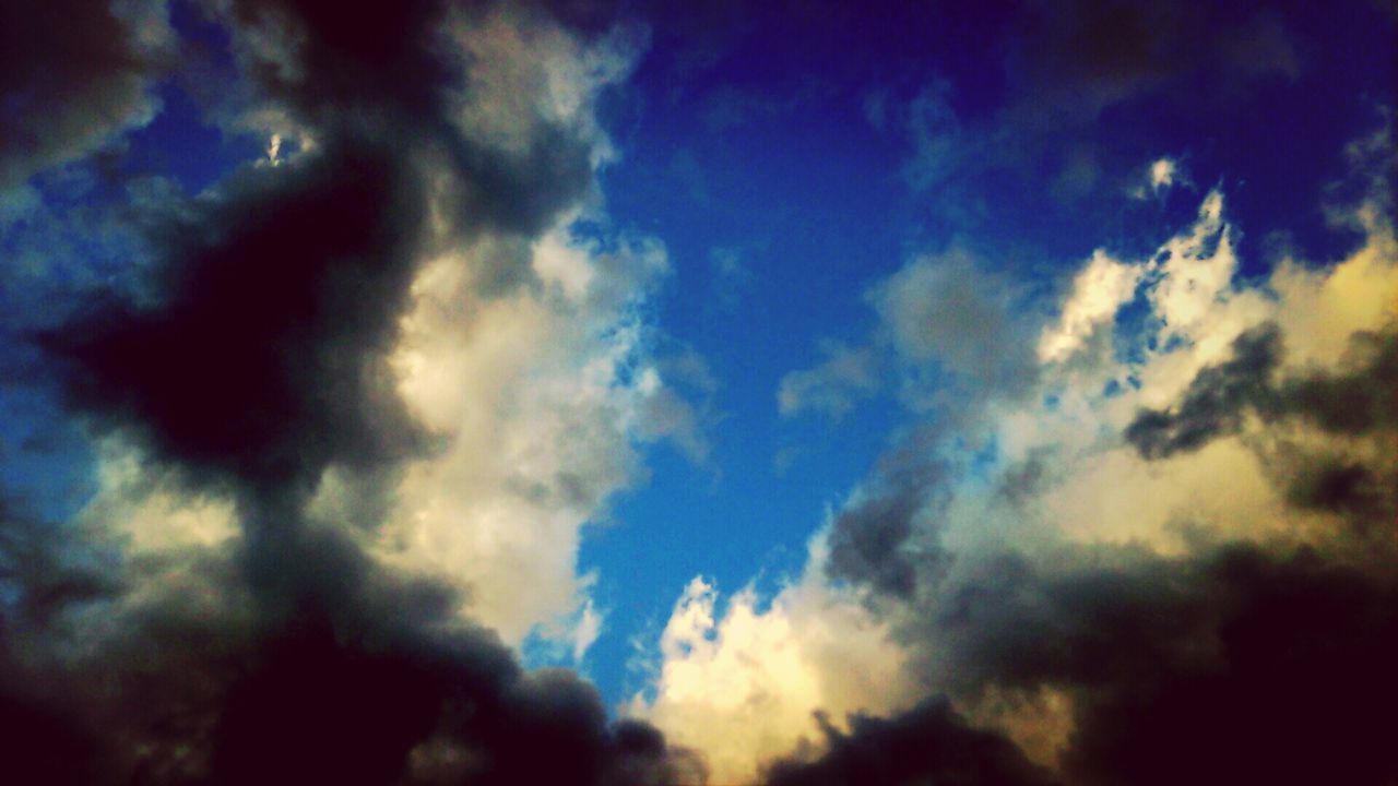 sky, low angle view, cloud - sky, cloudy, beauty in nature, nature, tranquility, scenics, cloudscape, sky only, cloud, blue, silhouette, tranquil scene, backgrounds, weather, dramatic sky, outdoors, dusk, full frame