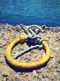 High angle view of rusty metal on shore