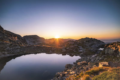 Scenic view of mountains against sky during sunset