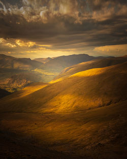 Scenic view of mountains against sky during sunset