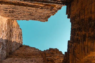 Low angle view of old ruin building against sky