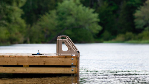 Boat by river against sky