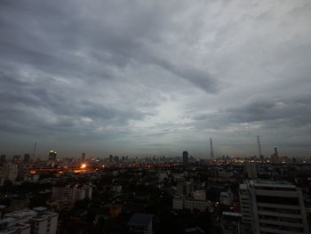 Cityscape against cloudy sky