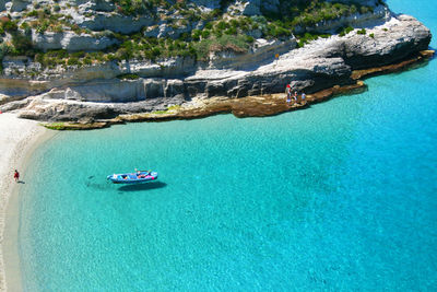 High angle view of sailboats on sea shore