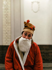 Portrait of man wearing red hat