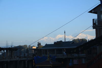 Low angle view of buildings against blue sky