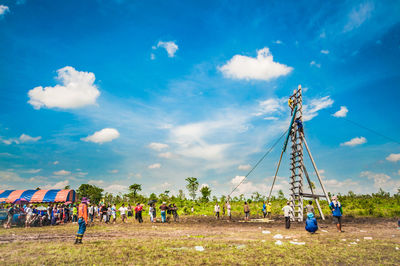 People on field against sky