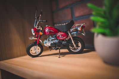 Close-up of motorcycle toy on wooden table