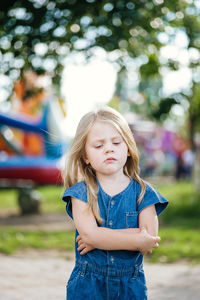 Portrait of a teenage girl standing outdoors