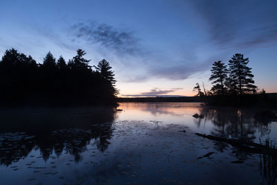 Loveling lake seen at sunrise during a blue hour morning, magog, quebec, canada